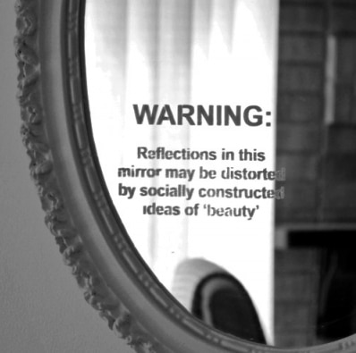 Mirror with quote about beauty standards