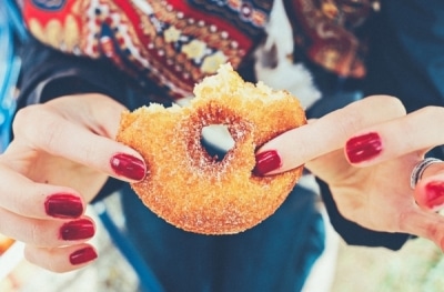 half eaten sugar dusted donut