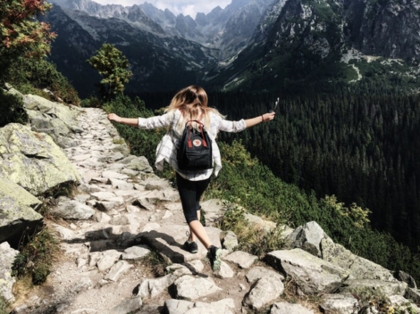 woman running down the mountain road