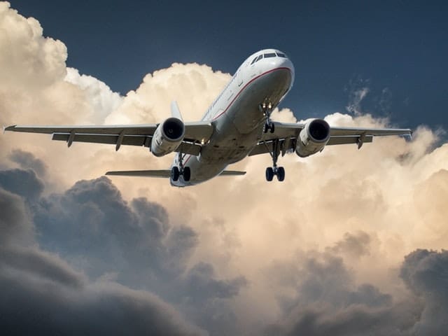 airplane flying in the clouds