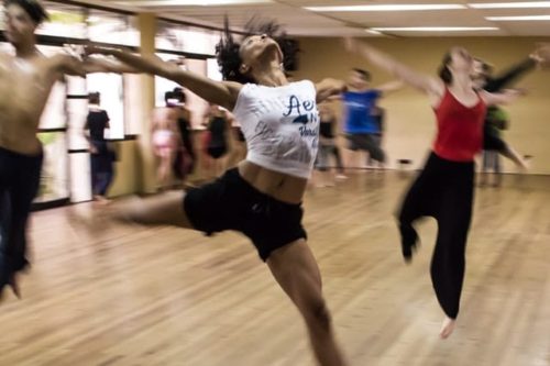 woman dancing in a group