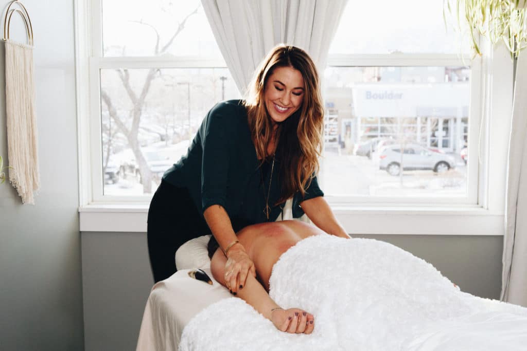 Doctor Caitlin Gordon Massaging a Female Patient - Amaluna Wellness