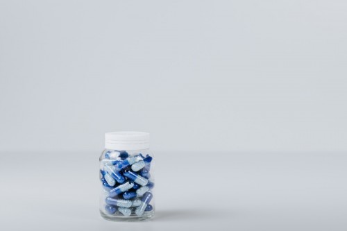 Blue Capsules in a Clear Bottle