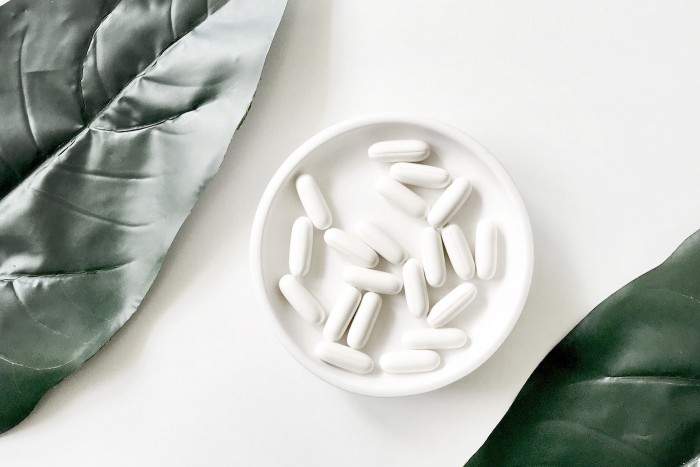 White Capsules in a White Bowl