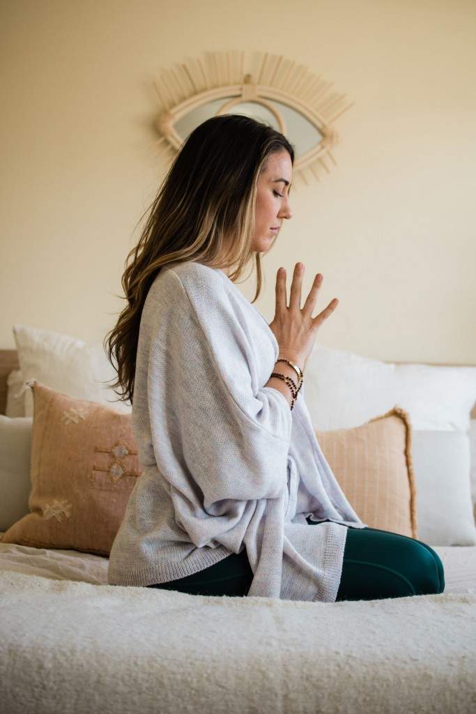 A Woman in a Meditation Pose - Amaluna Wellness