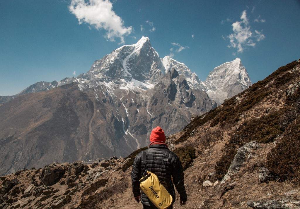 A Man Hiking in the Mountain