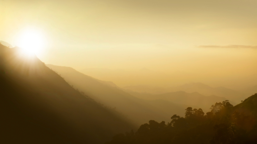 morning sun peeking over mountain tops